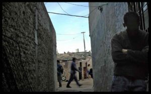 A narrow passageway in the slum neighborhood of Villa 20