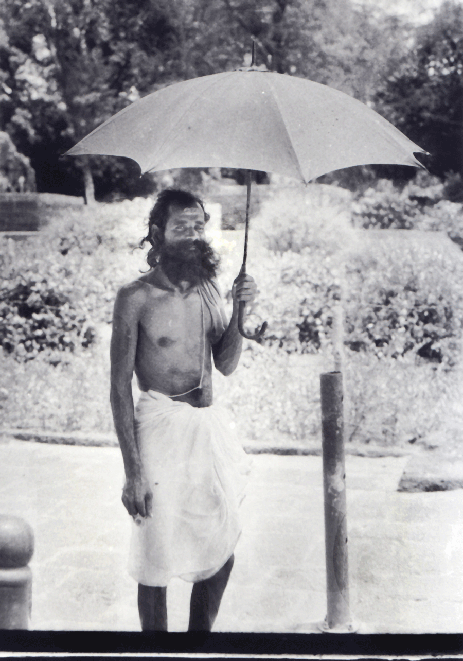 A sadhu with an umbrella 