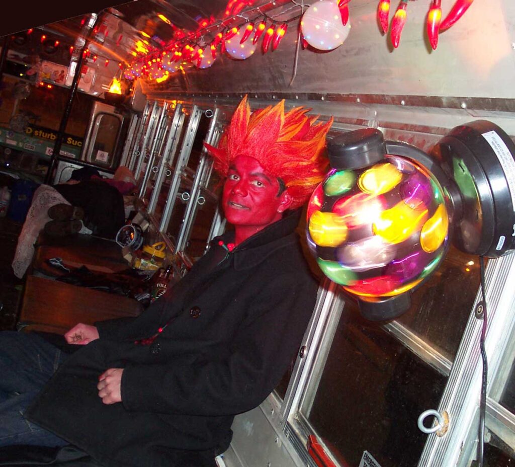 A rider on the artbus dressed as a devil